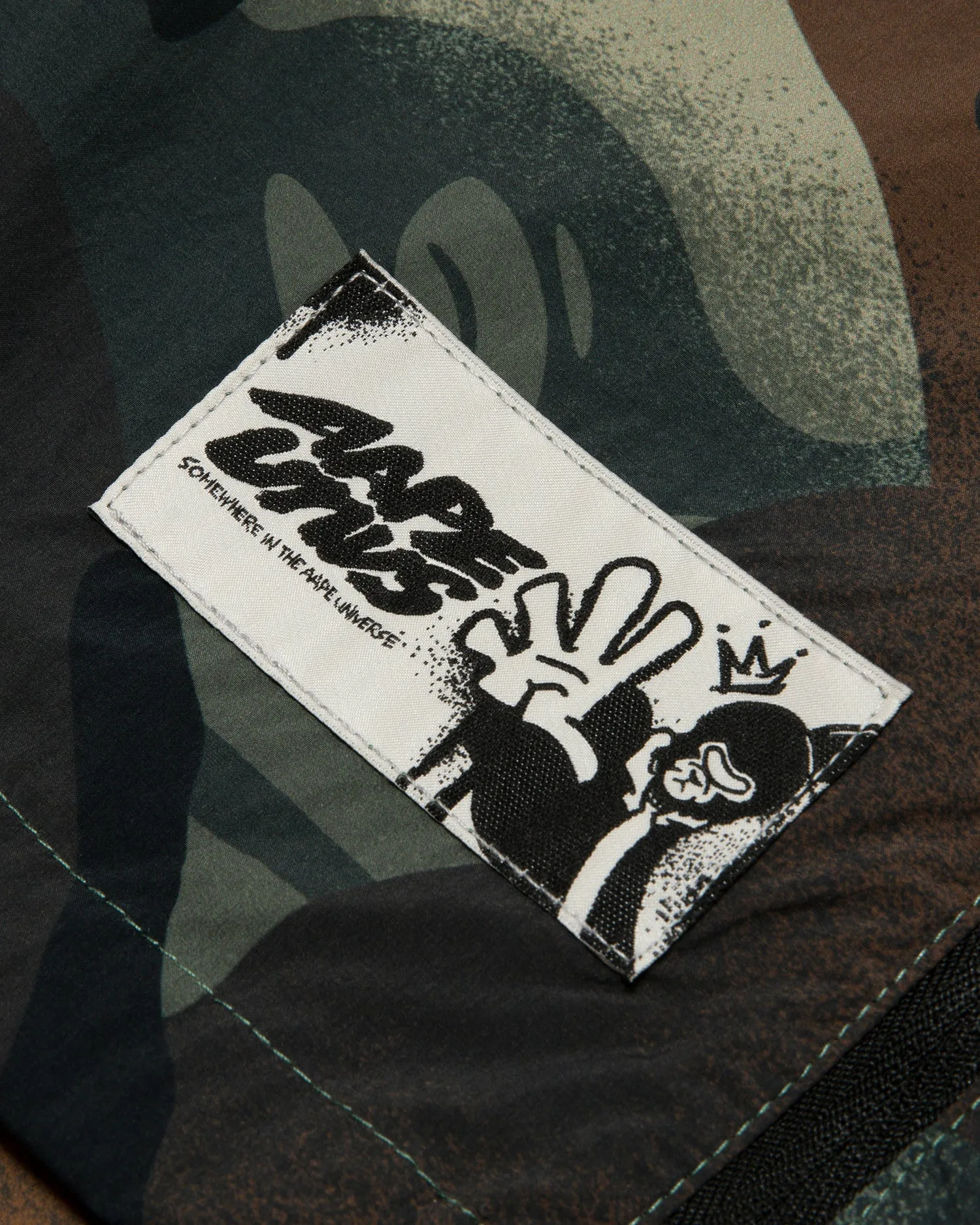 Moonface logo camo windbreaker